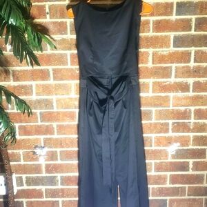 Black romper with tie on front.